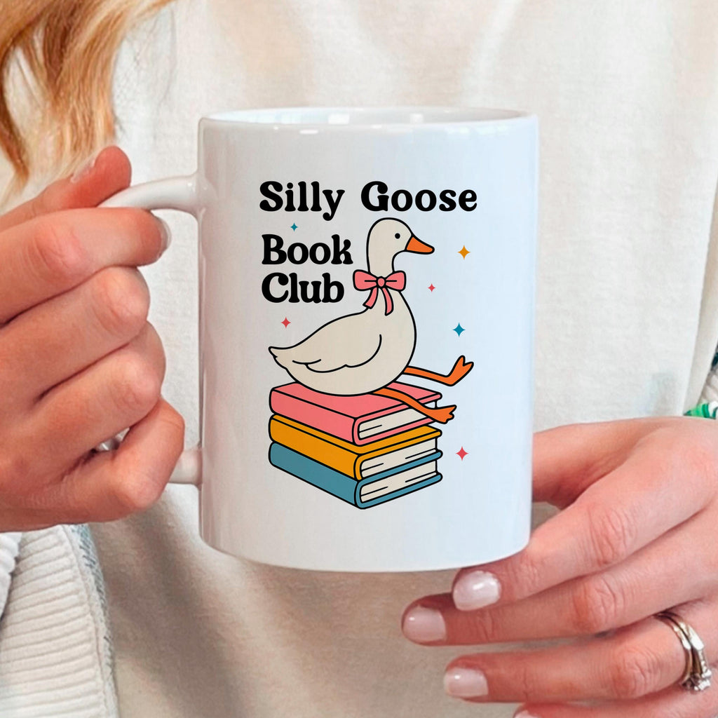 White ceramic mug with goose book club design and 'Silly Goose Book Club' text