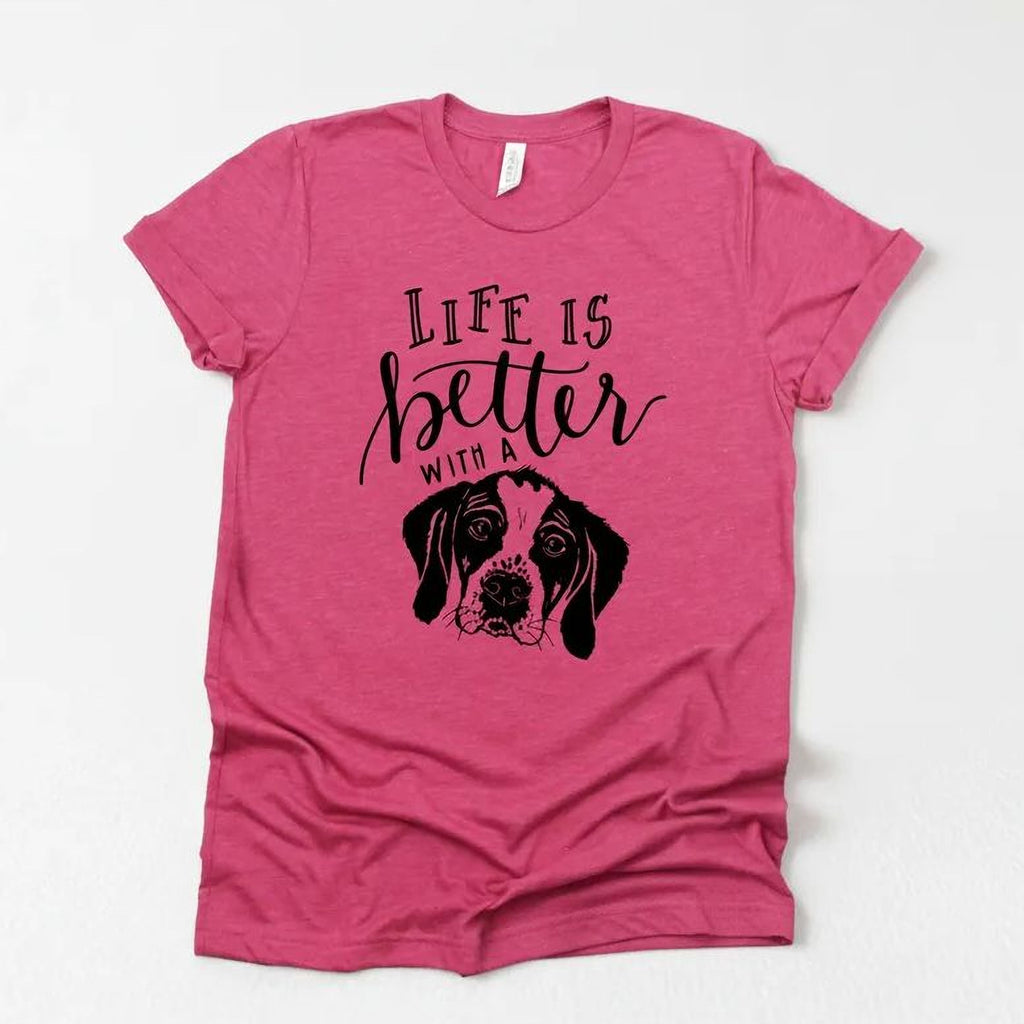 Pink unisex dog mom T-shirt with “Life is better” text and black dog graphic