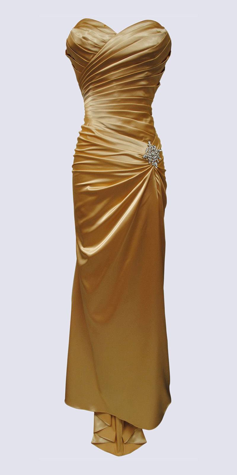 Gold satin sweetheart dress with ruched bodice, side drape, and jeweled waist detail