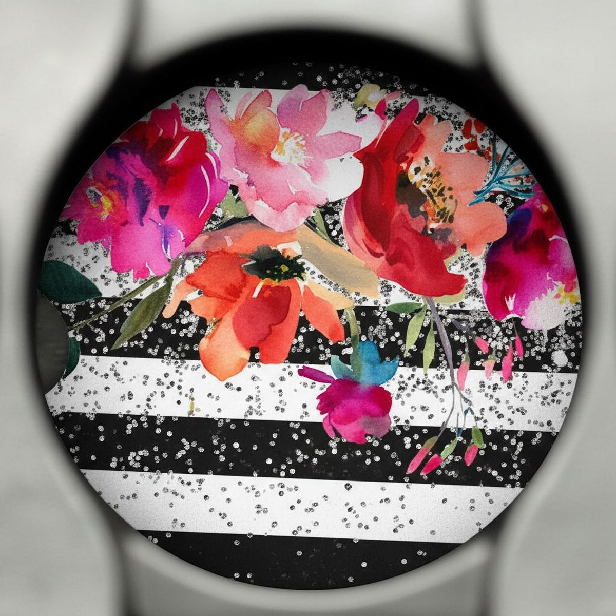 Floral car coaster with black edging and black-and-white striped background