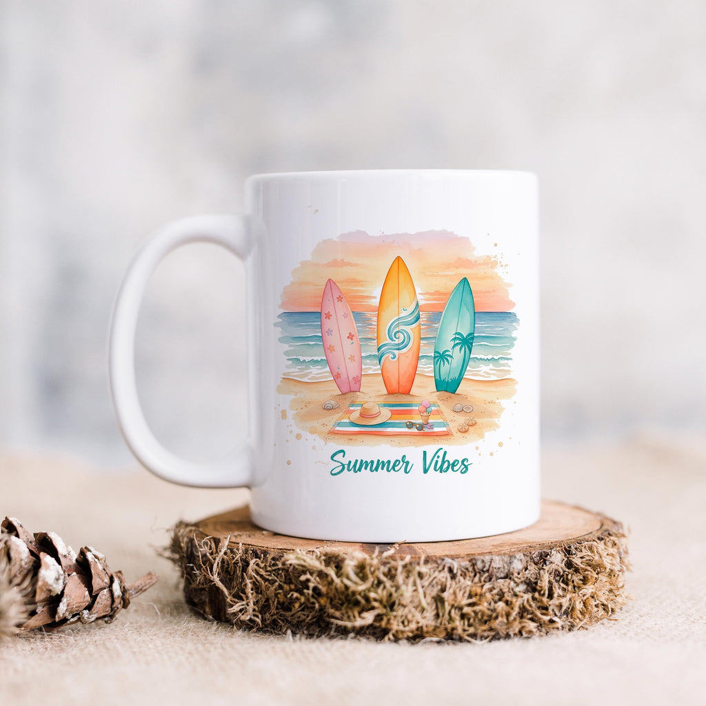 White ceramic mug with surfboard artwork and 'Summer Vibes' in teal script