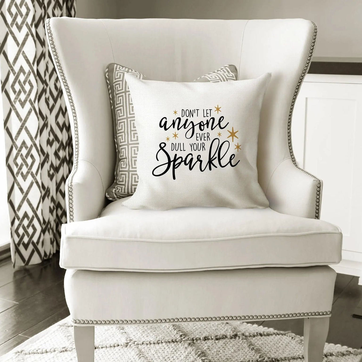 White throw pillow cover with 'Don't let anyone ever dull your sparkle' quote and gold stars
