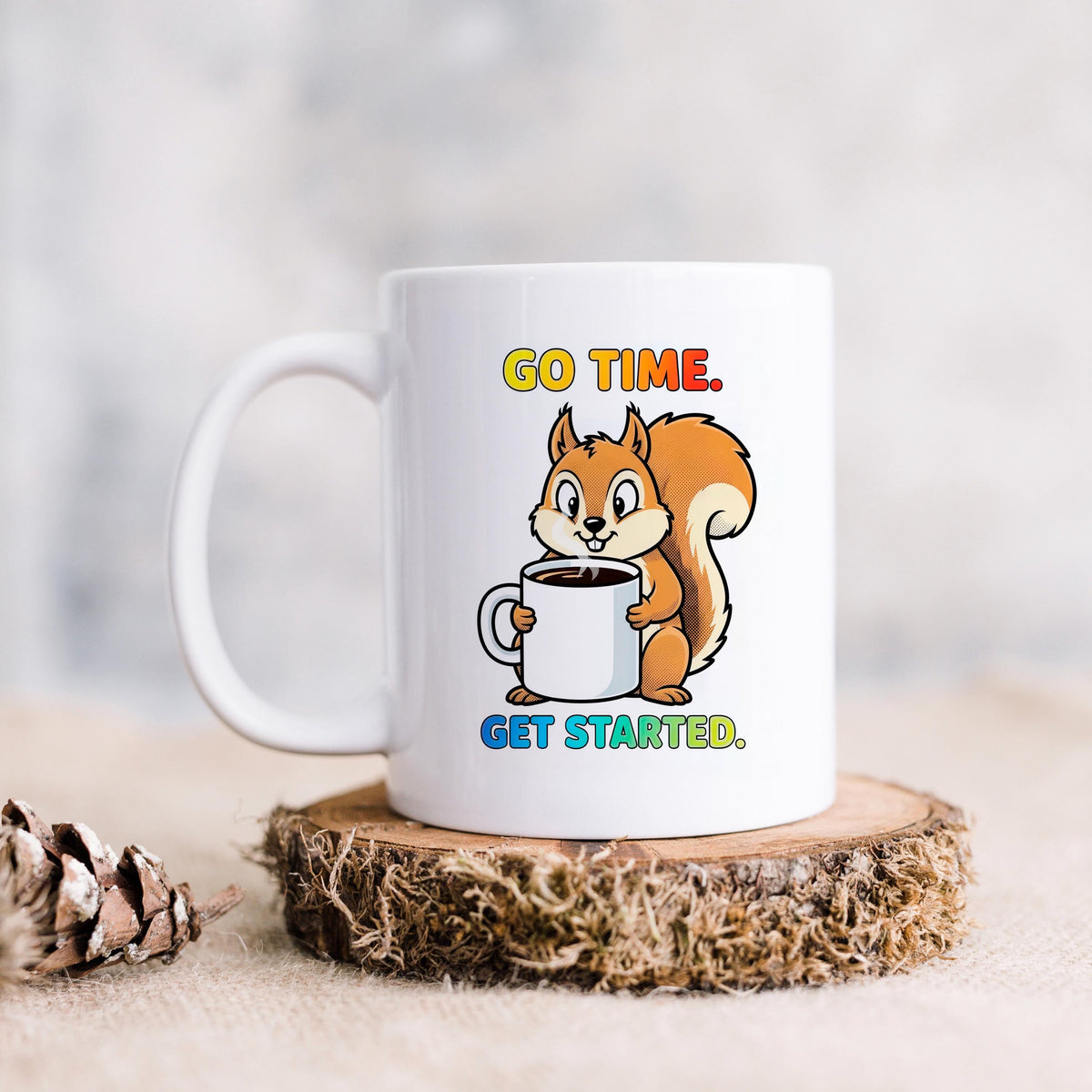 White coffee mug with squirrel holding a cup; "GO TIME. GET STARTED."
