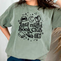 Moss green graphic tee with 'Late night Book Club' books and moon emblem