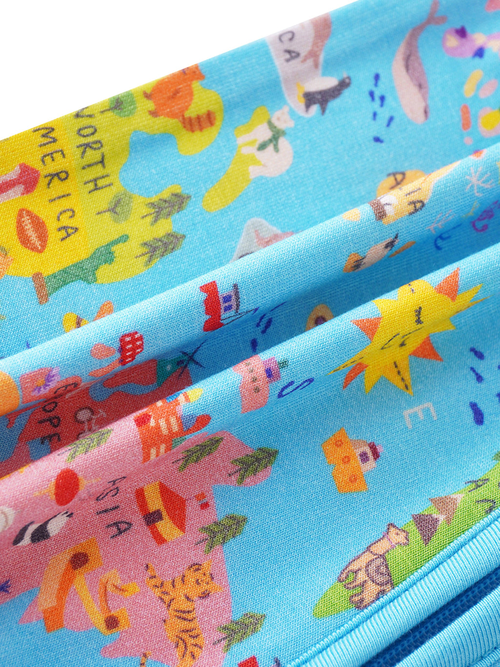 Baby bamboo romper fabric close-up with colorful world map icons and animals