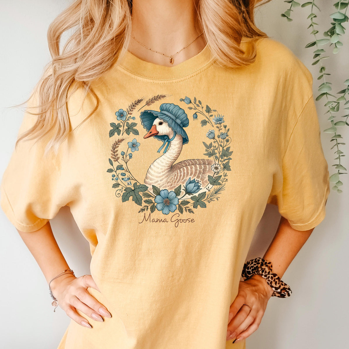 Mustard T-shirt with blue bonnet goose floral wreath graphic