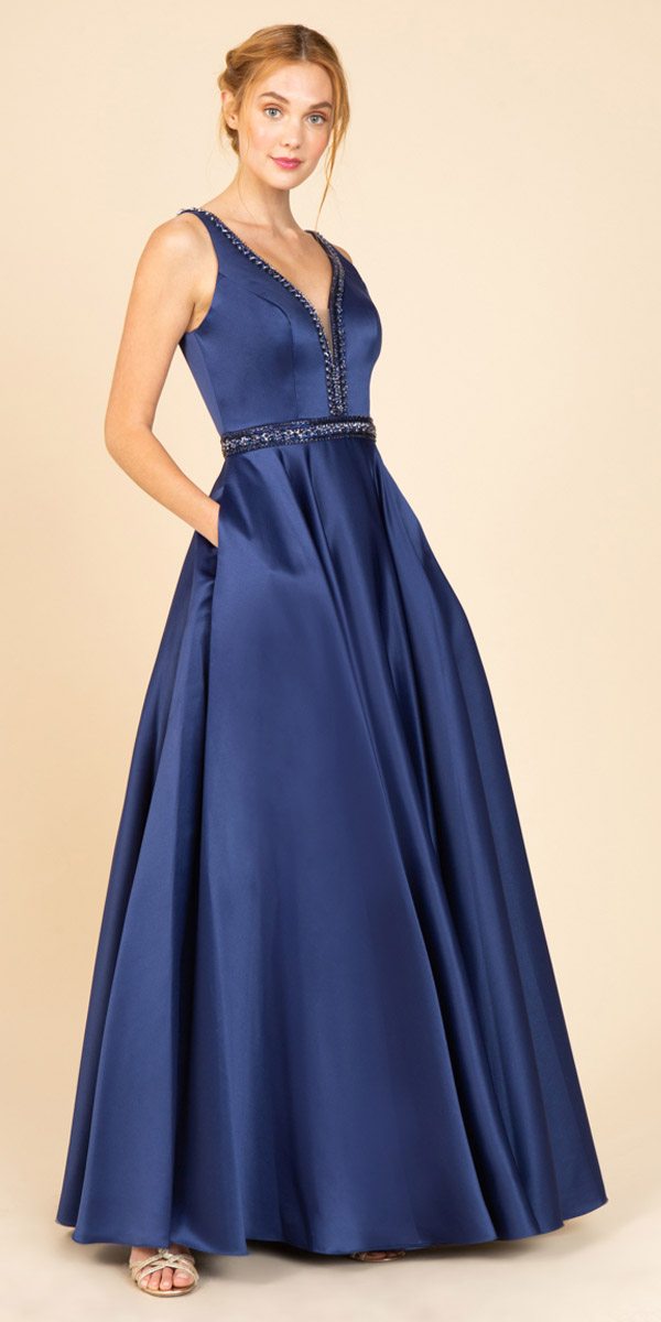 Blue embellished long prom dress, V-neck, sleeveless, bead-trim waist, pleated A-line skirt
