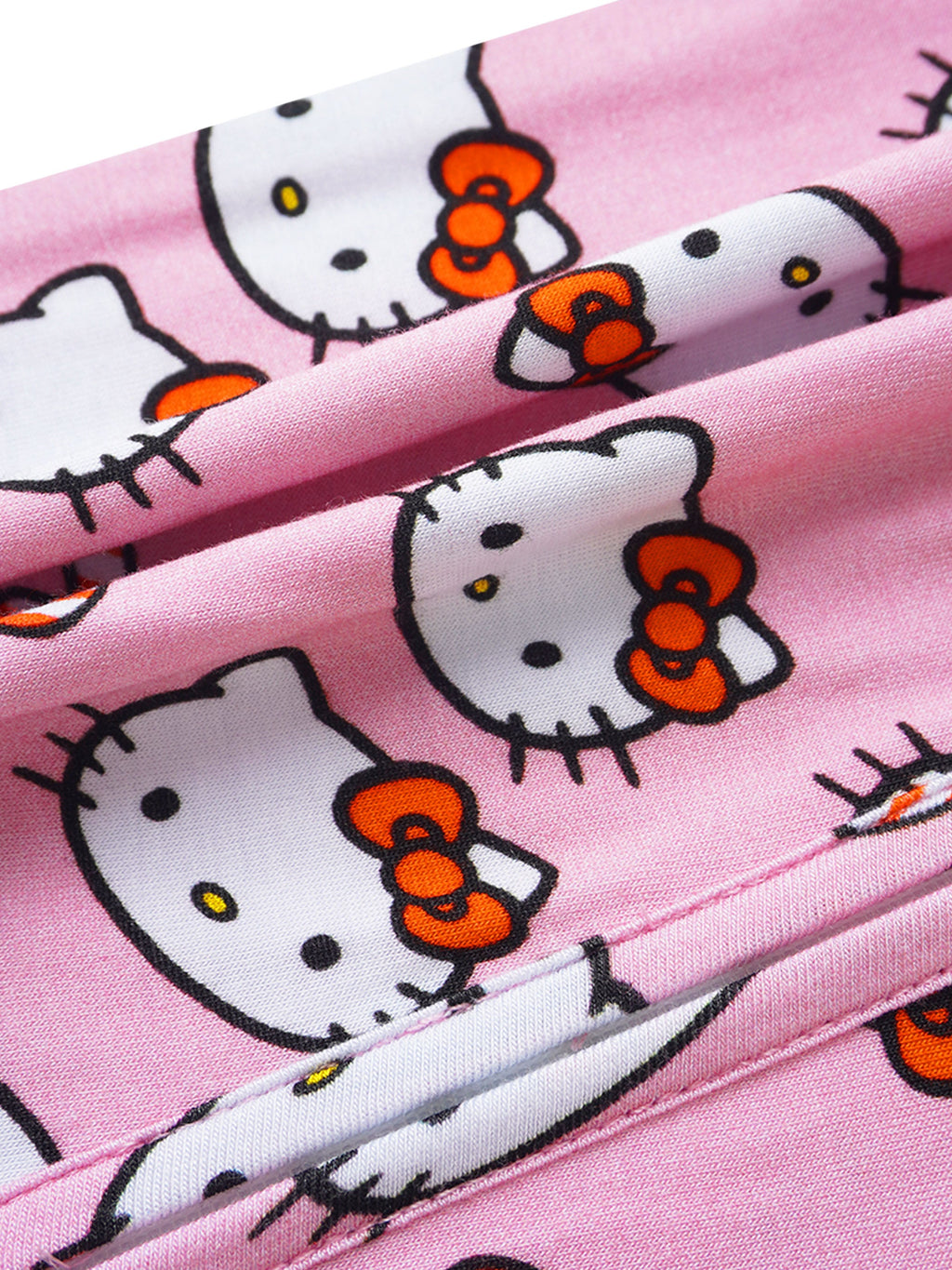 Close-up of pink Hello Kitty printed fabric with soft stretch finish