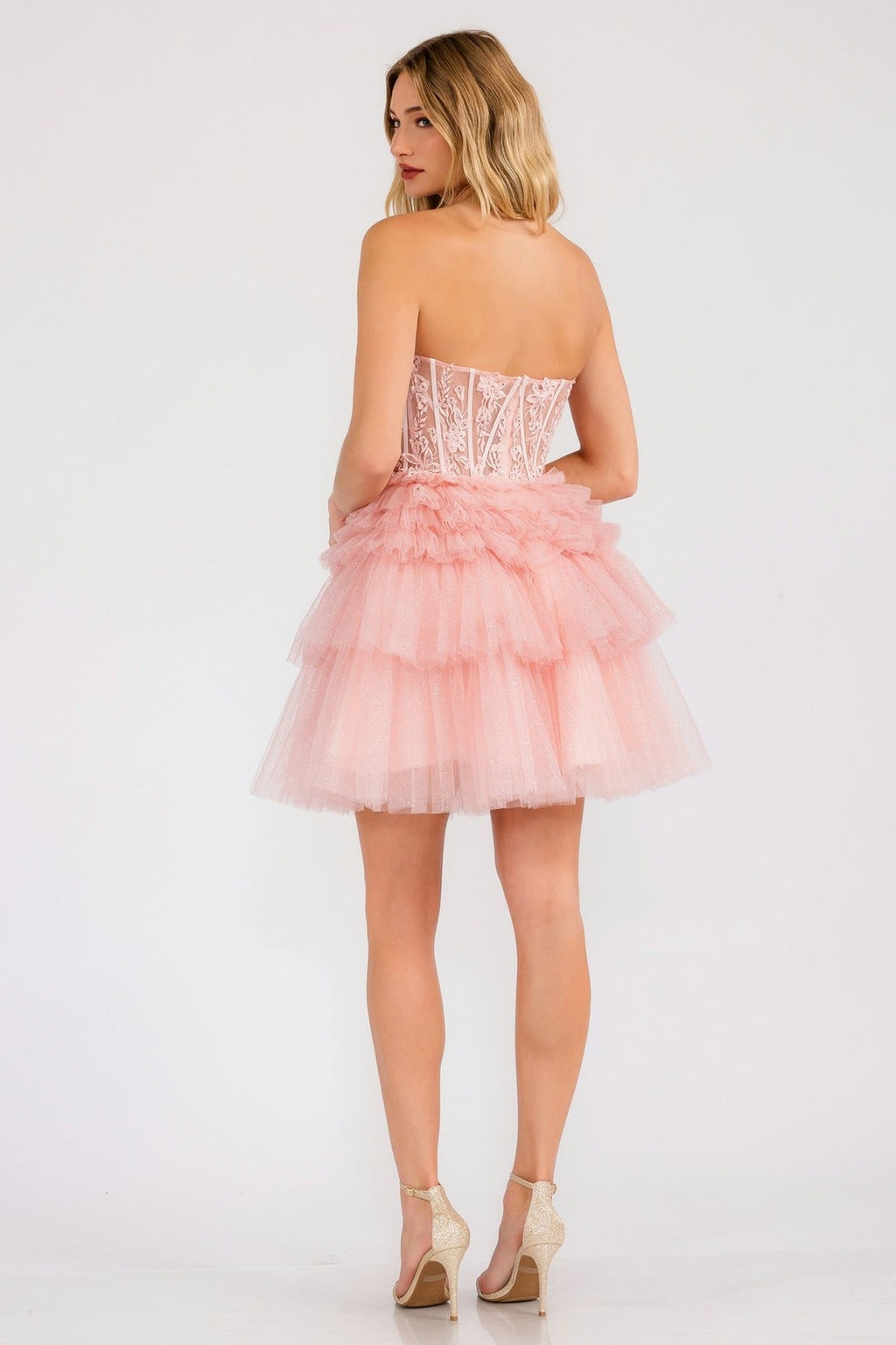 Blush strapless lace corset cocktail dress with tiered ruffle skirt, back view