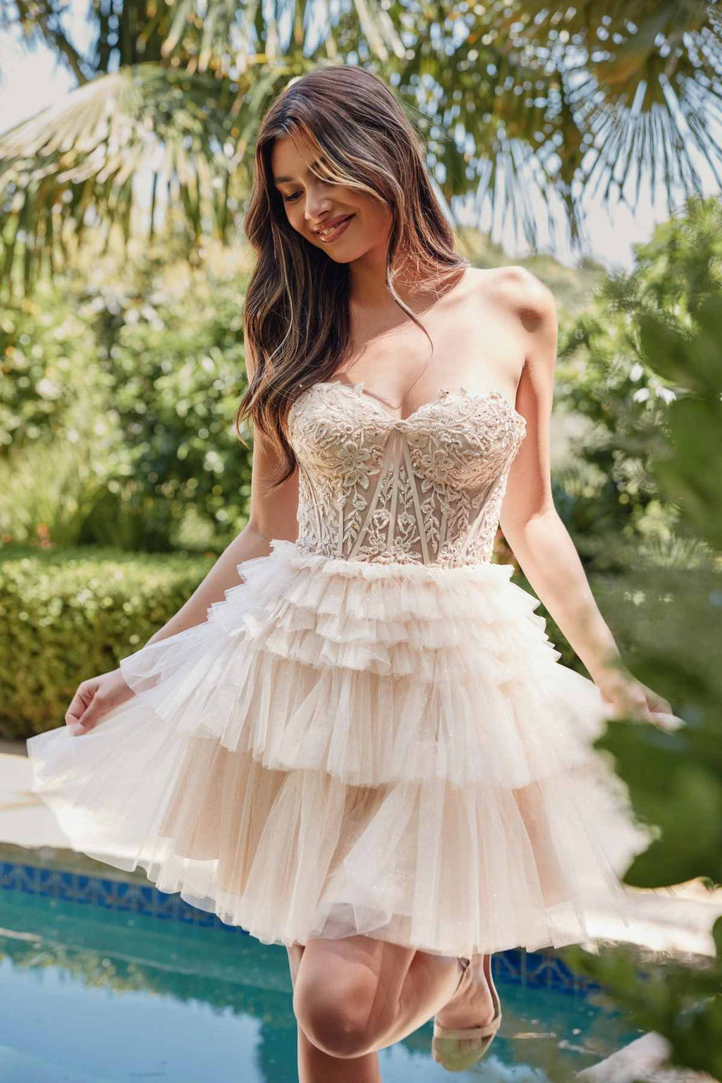 Strapless corset-style cocktail dress with lace bodice and tiered tulle ruffle skirt, cream, side