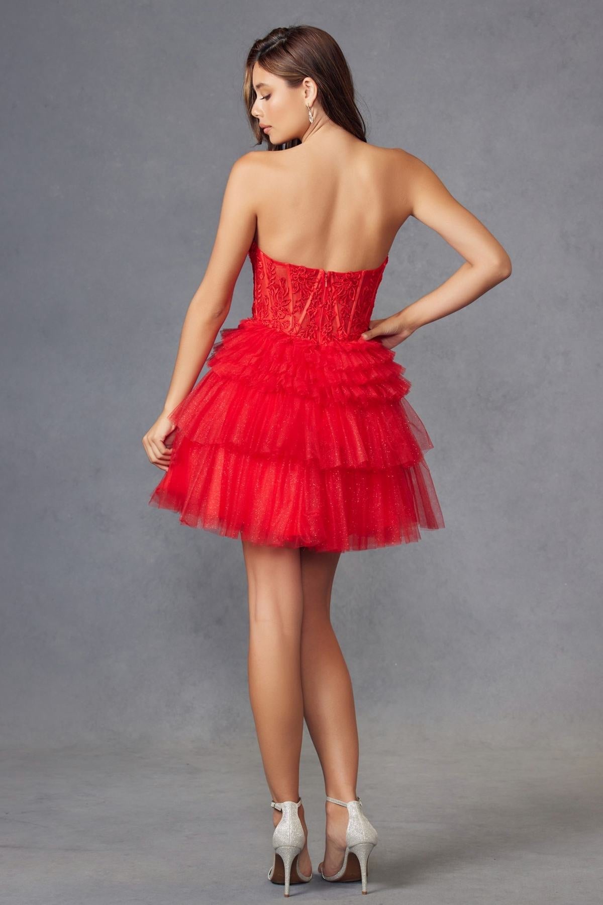 Red strapless lace corset dress with tiered tulle ruffle skirt, back view