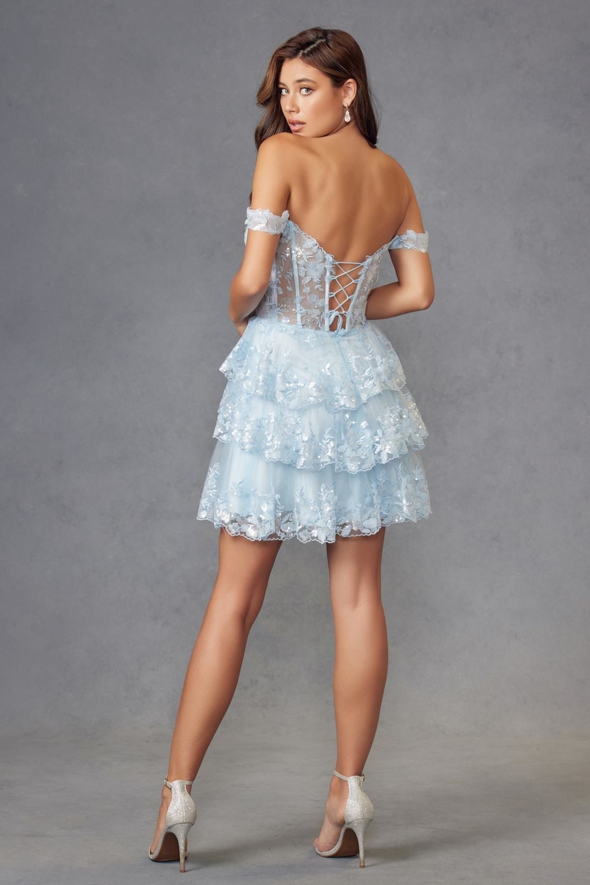 Light blue short A-line cocktail dress with tulle and sequins, open back, ruffled layers