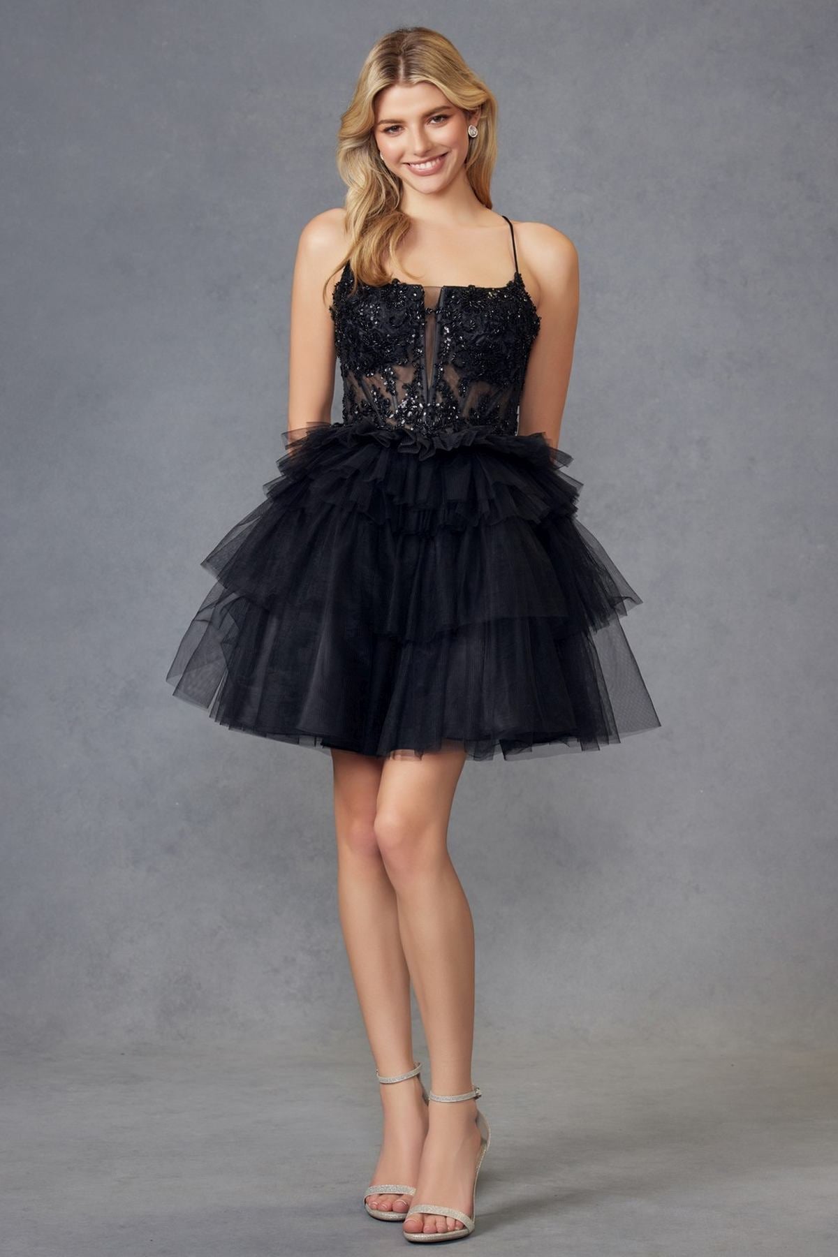 Black corset-style tulle ruffle cocktail dress with spaghetti straps and layered skirt