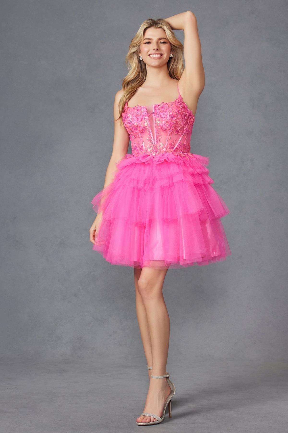 Hot pink corset-style tulle ruffle cocktail dress with layered tiered skirt and thin straps