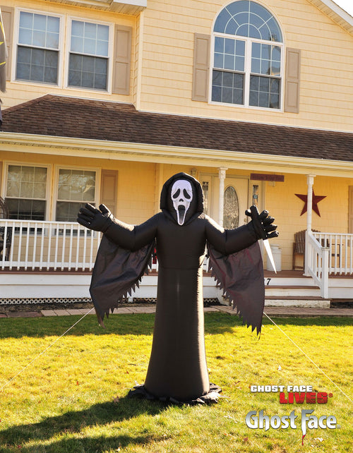 Black 6 ft inflatable ghost figure with hood and skull mask, glowing light-up face