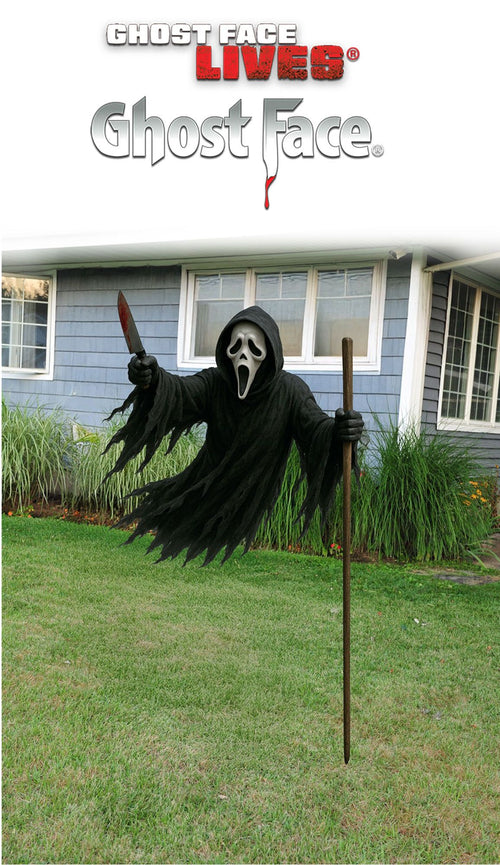 Black flying ghost face yard prop with fluttering tattered cape and skull mask