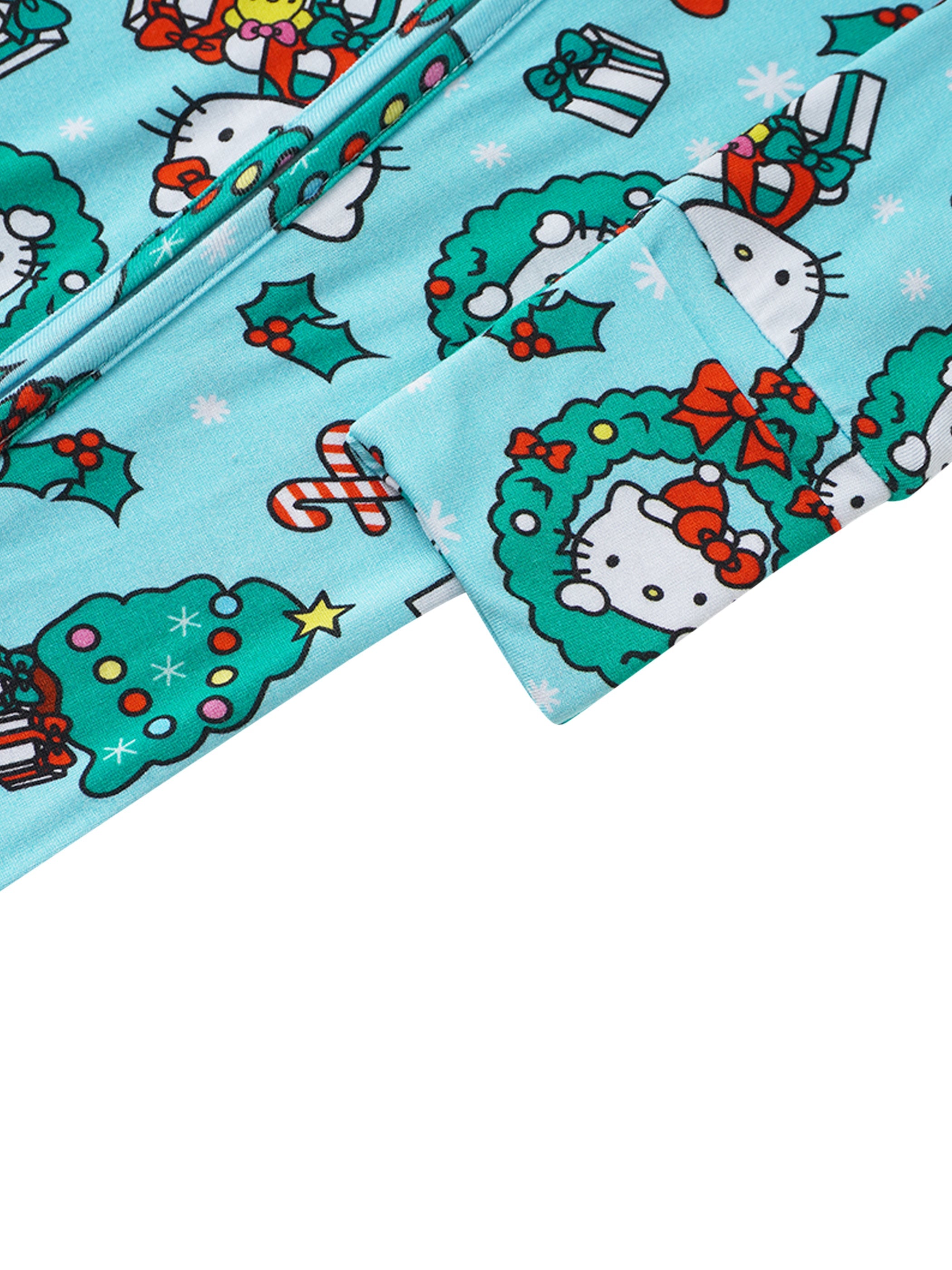 Baby romper cuff and sleeve detail, light blue with festive Hello Kitty wreath pattern