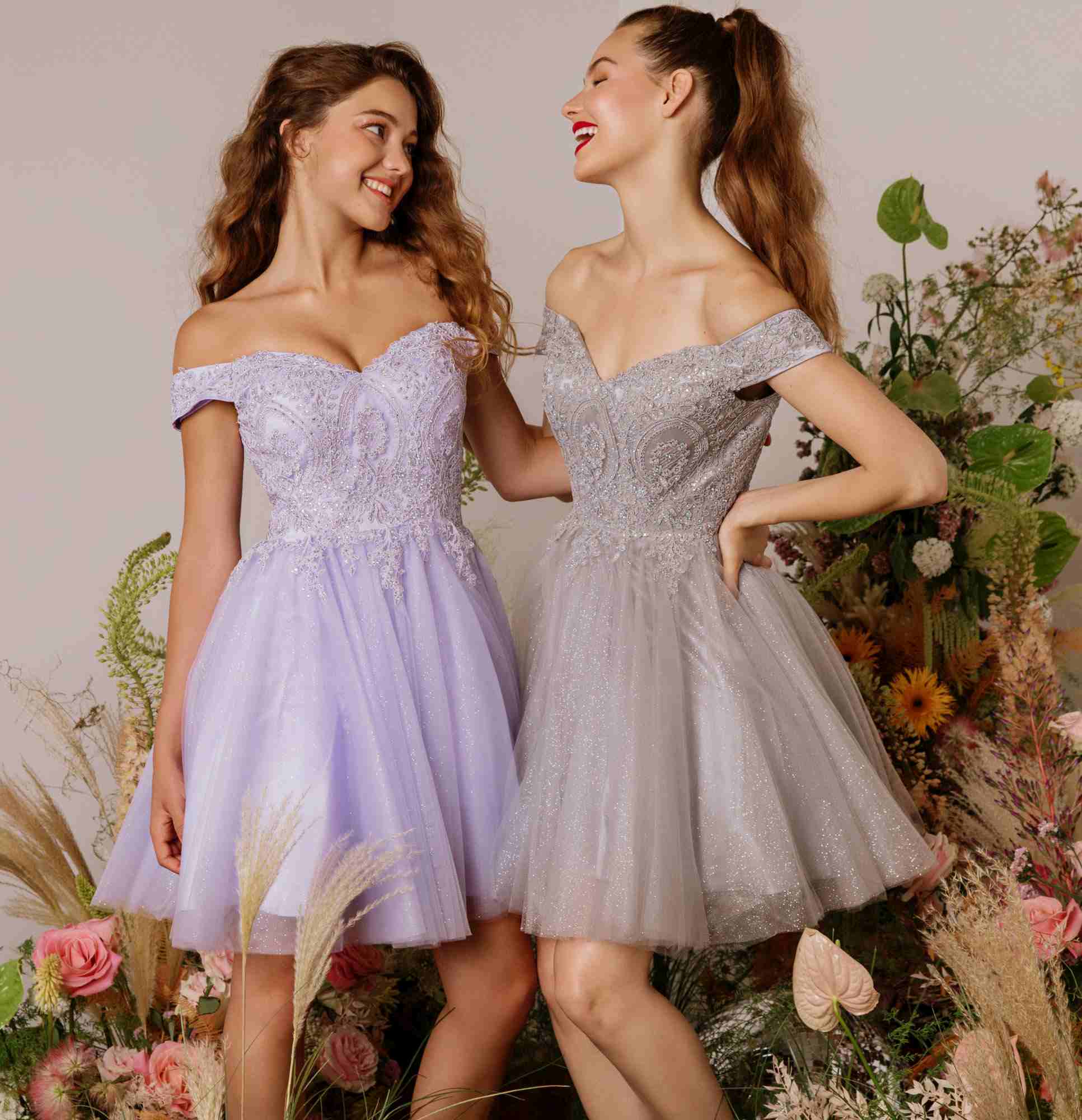 Two off-shoulder A-line glitter mesh dresses: lavender and light gray, short flared skirts
