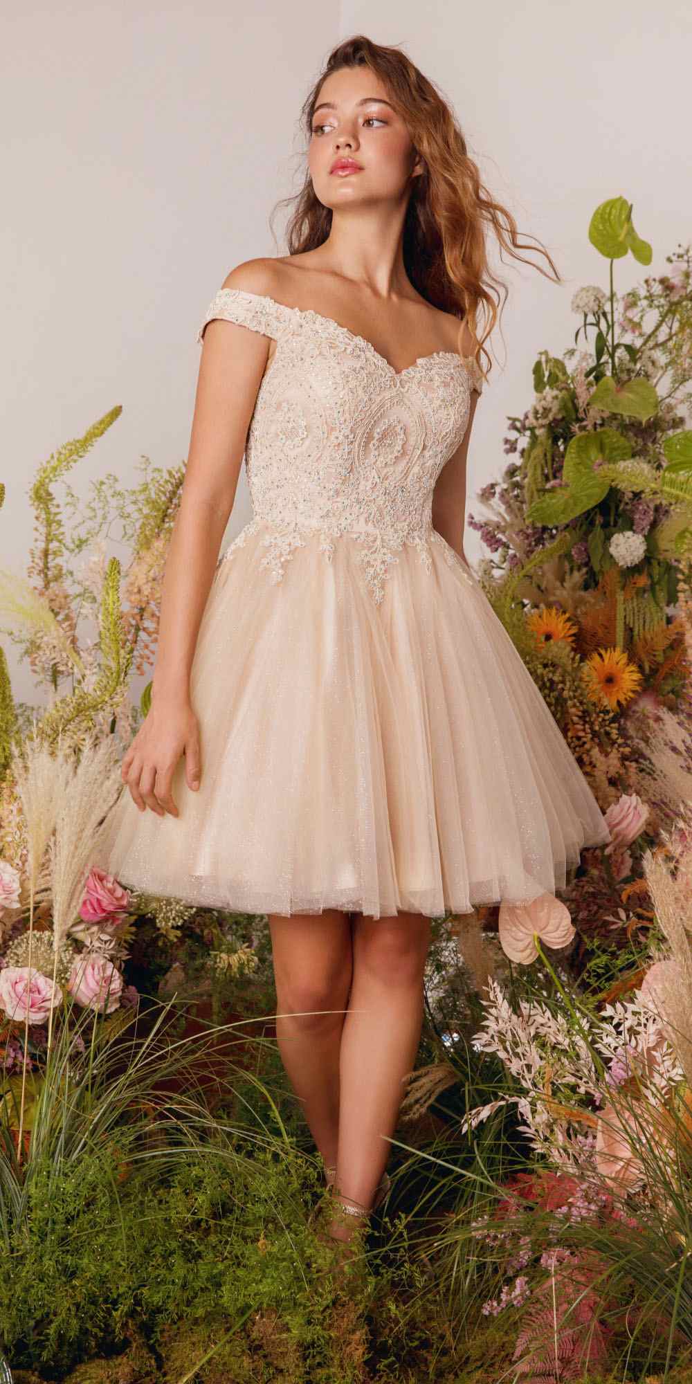 Off-shoulder A-line glitter mesh dress in ivory, angled full-length view with sparkly texture