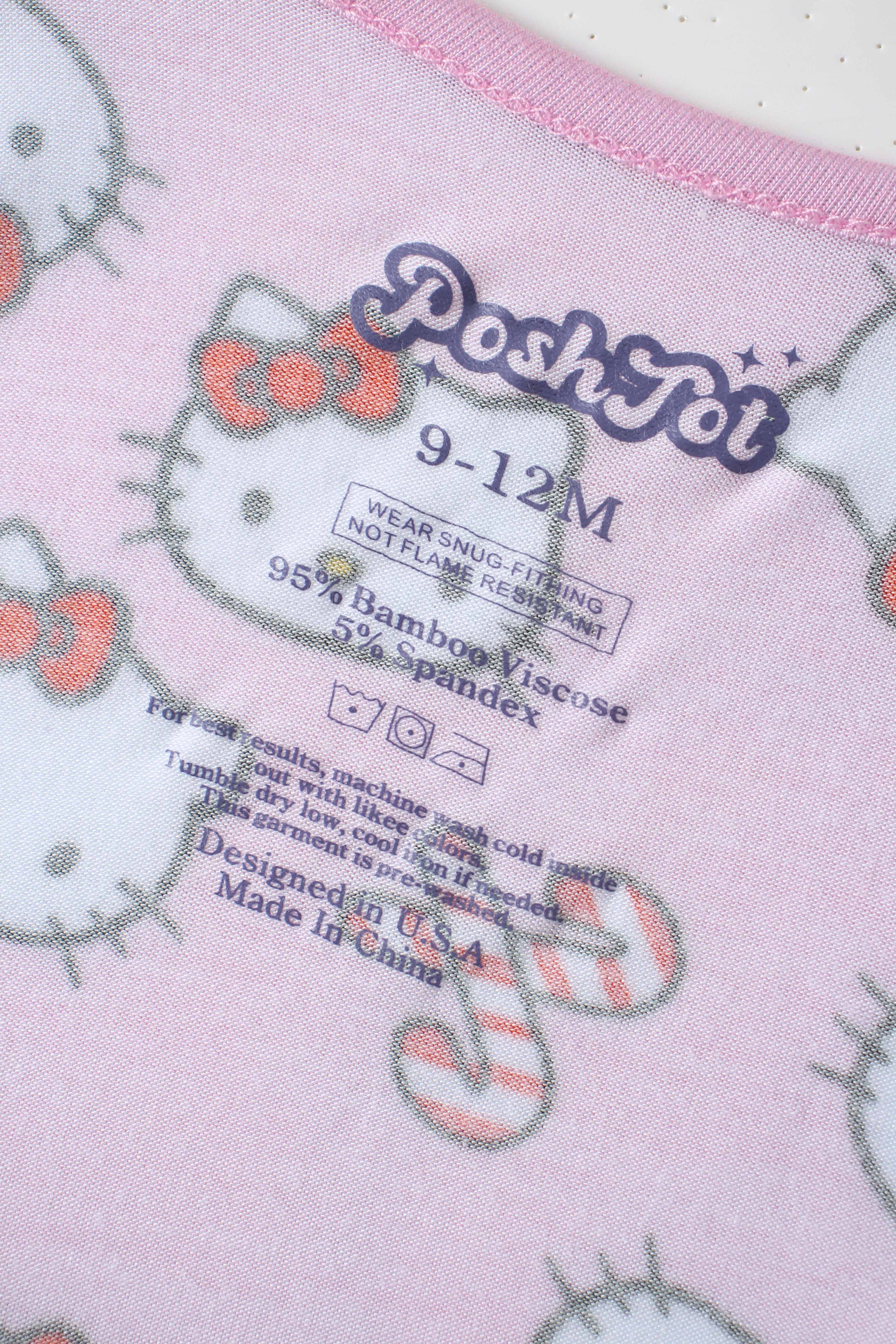 Inside label on pink Hello Kitty baby romper showing size and bamboo viscose details