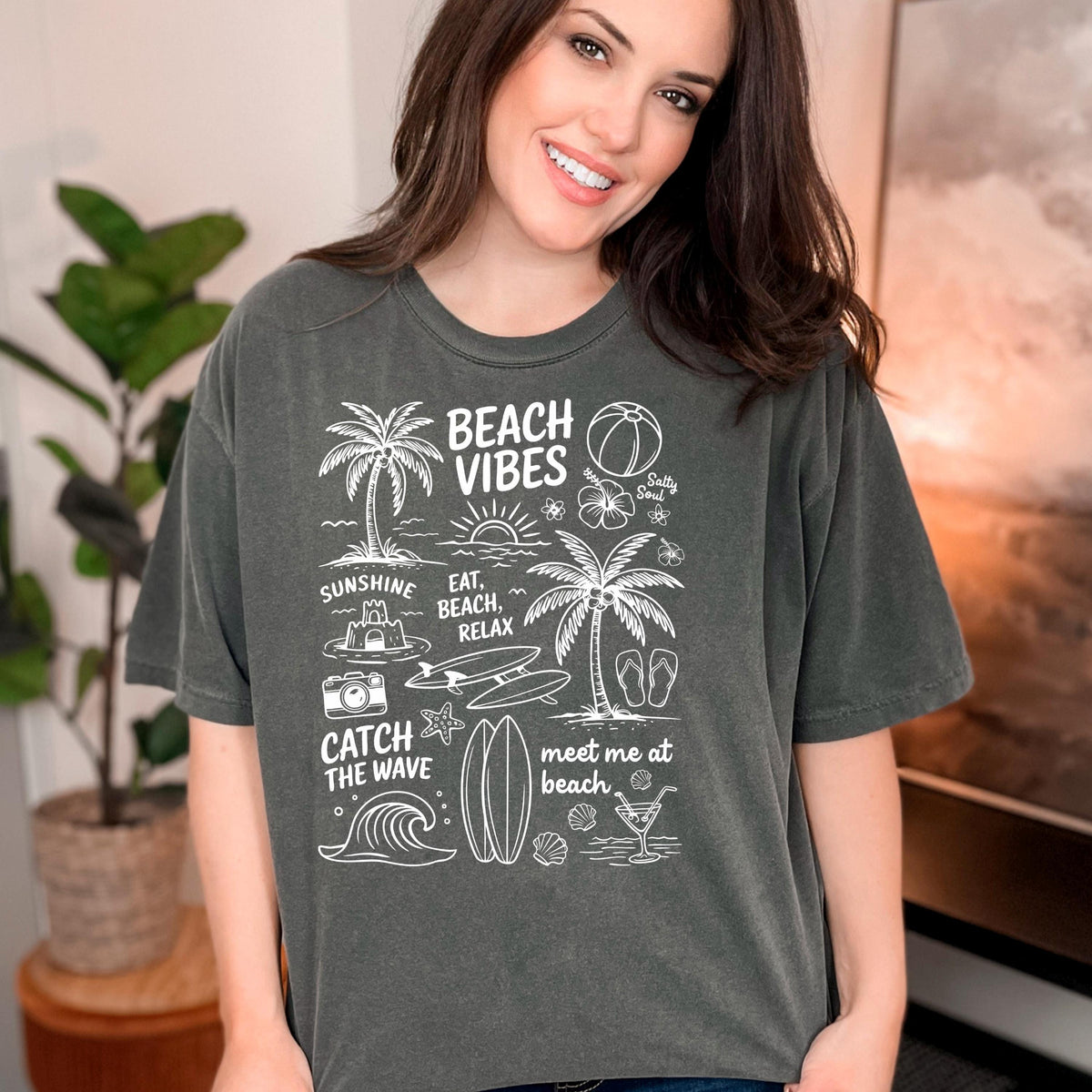 Dark green women’s T-shirt with white “Beach Vibes” beach graphic on the front
