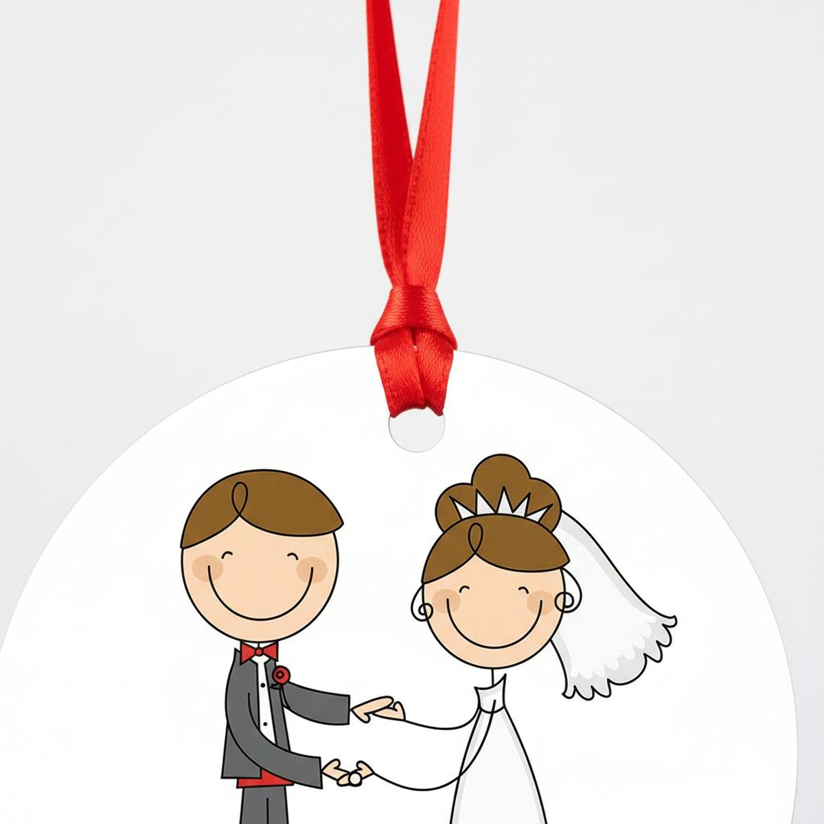 White round wedding ornament with red ribbon top, illustrated bride and groom holding hands