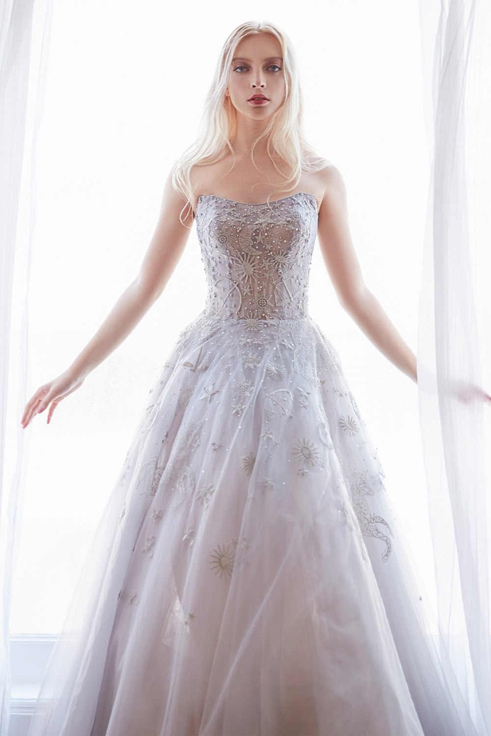 Strapless long tulle dress in light silver with textured bodice and star accents