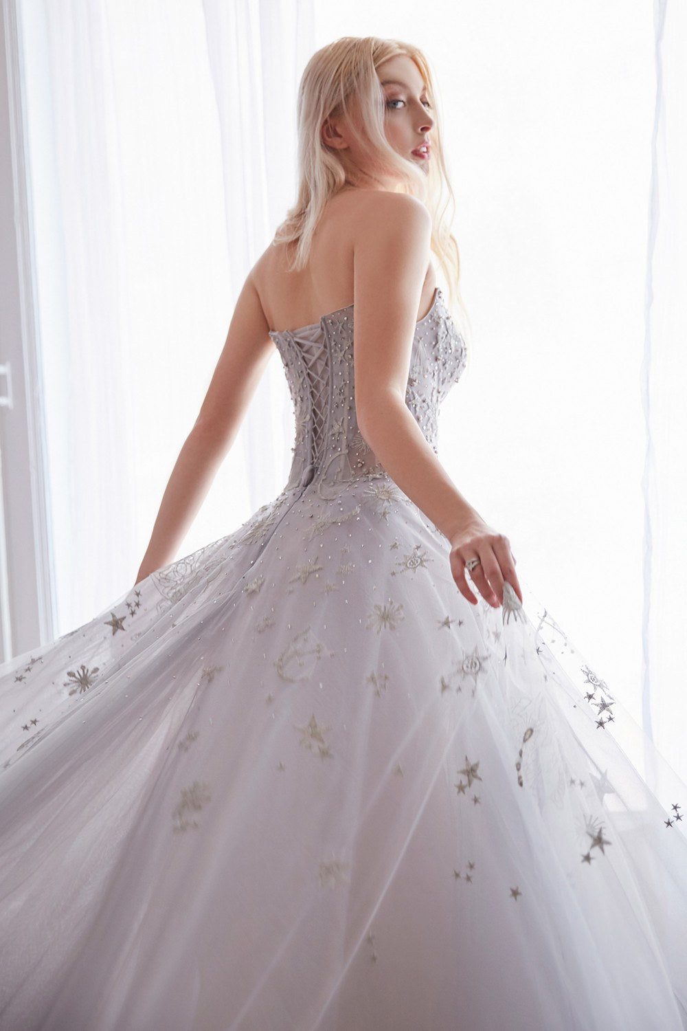 Light silver strapless long tulle dress with open back and starry constellation details
