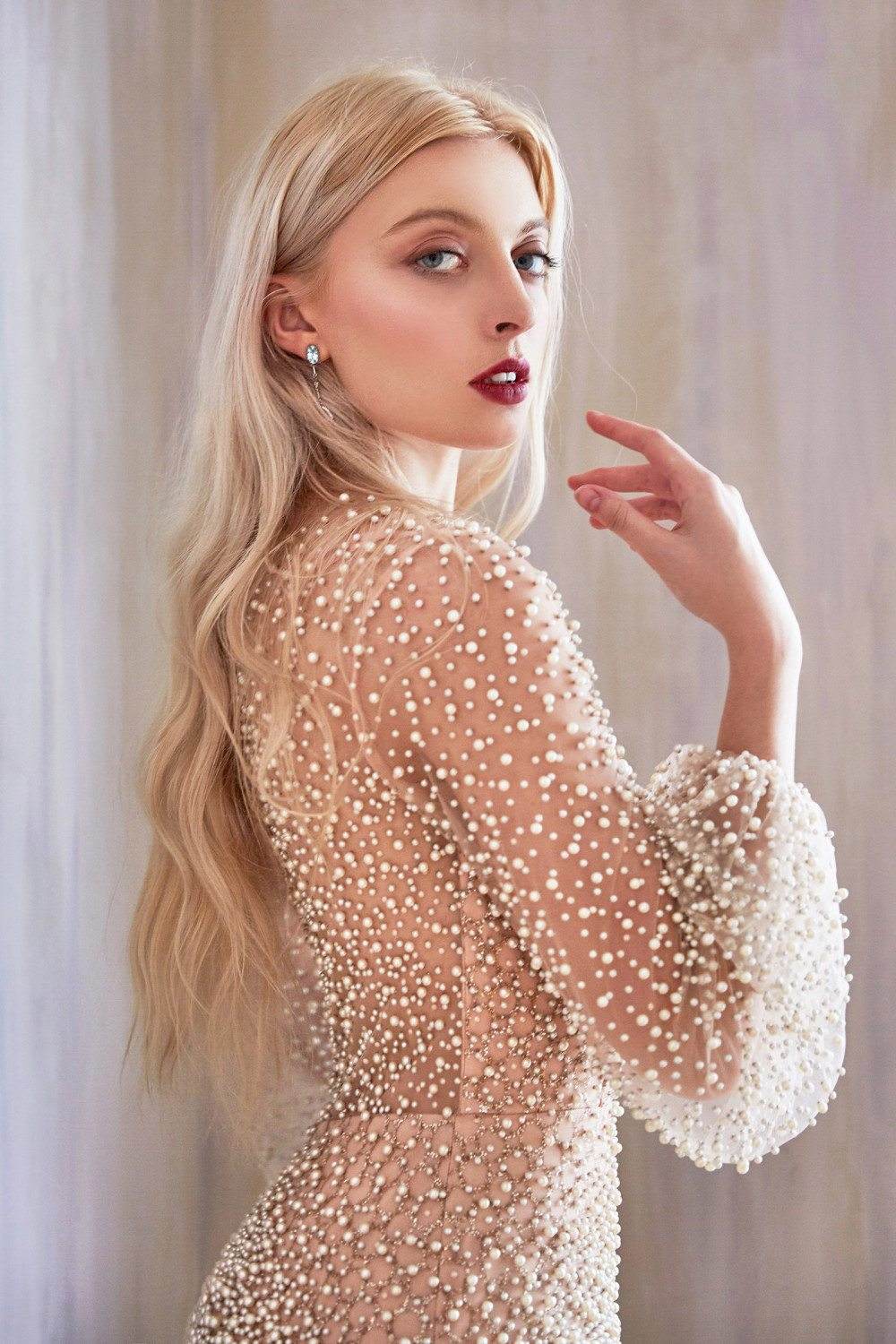 Pearl beaded long sleeve dress in off-white/nude, high neckline and fitted waist