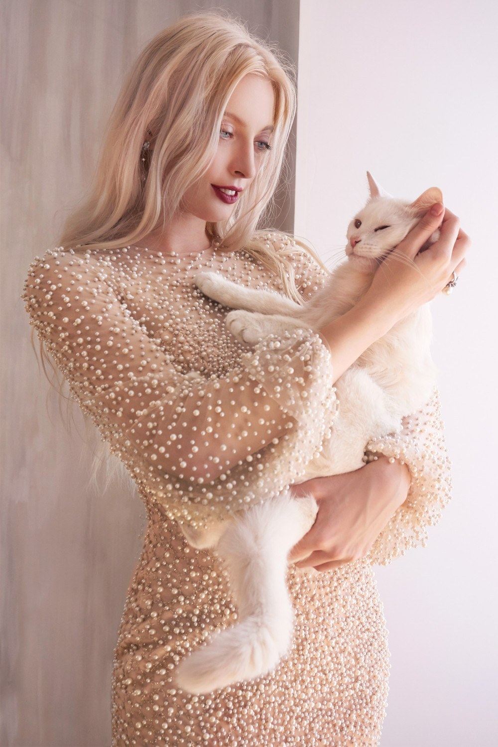 Pearl beaded long sleeve dress in off-white/nude with high neckline and flared skirt