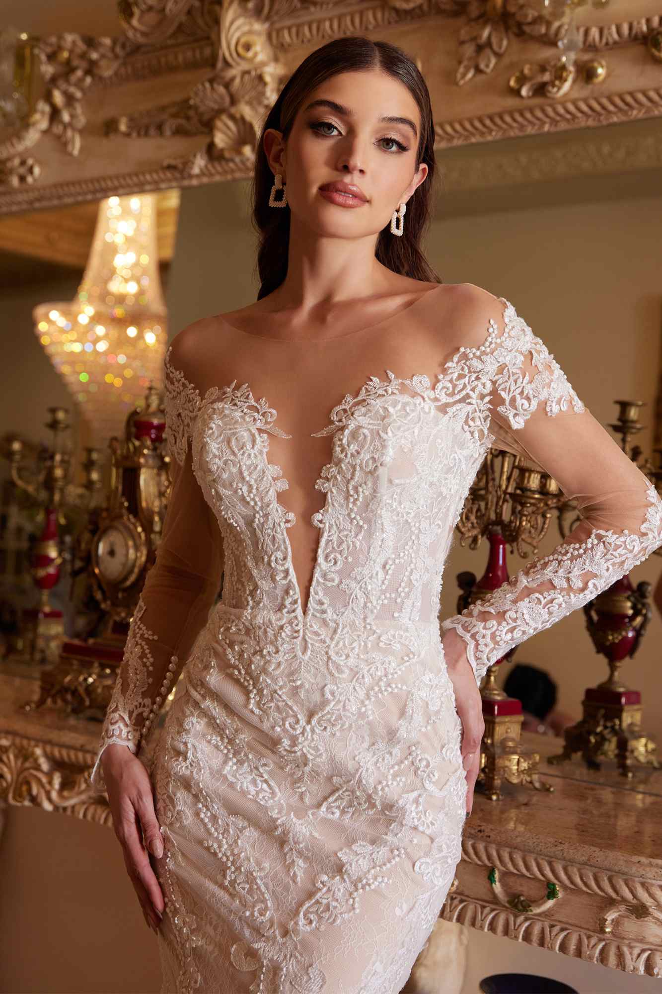 Off-white lace mermaid gown with lace shoulder appliques and illusion long sleeves