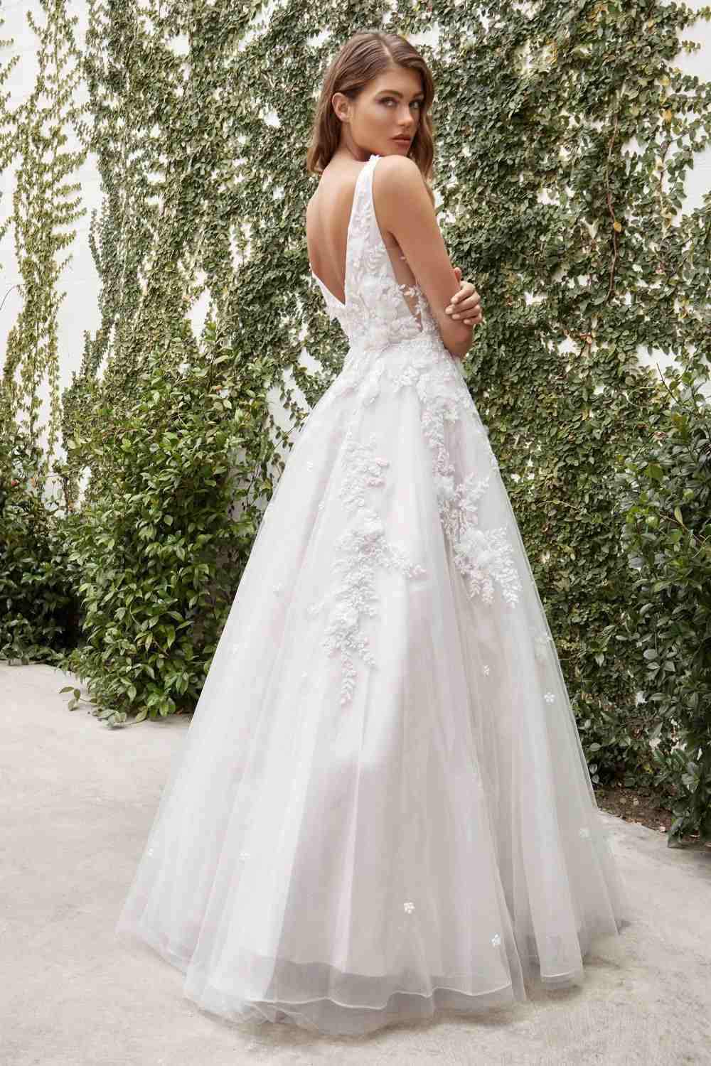 Ivory A-line wedding gown with lace appliqué bodice and flowing tulle skirt