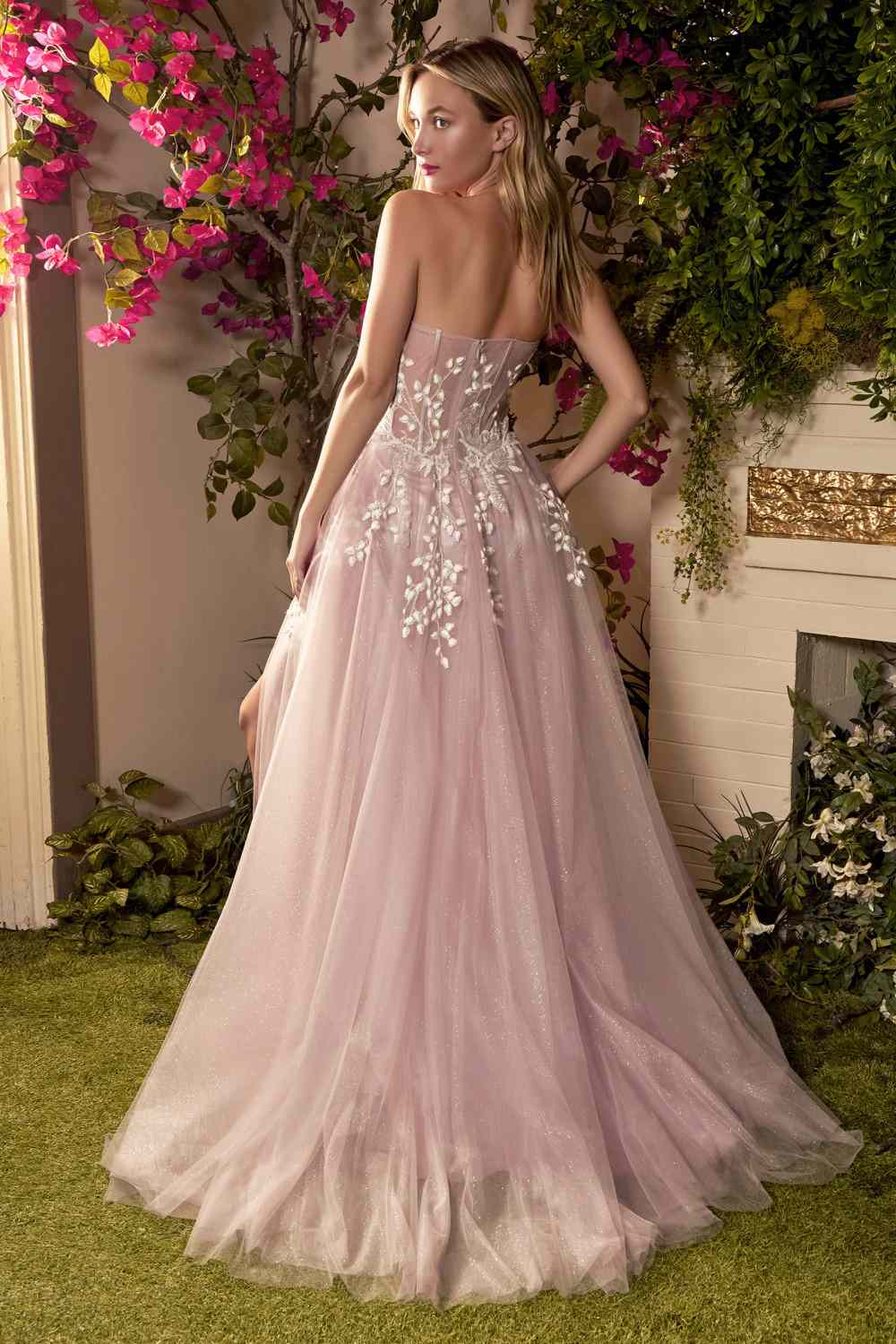 Light pink corset gown with open back and flowing tulle skirt