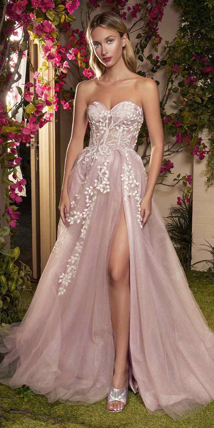 Light pink corset gown with sweetheart neckline, sheer skirt, and floral bead appliques