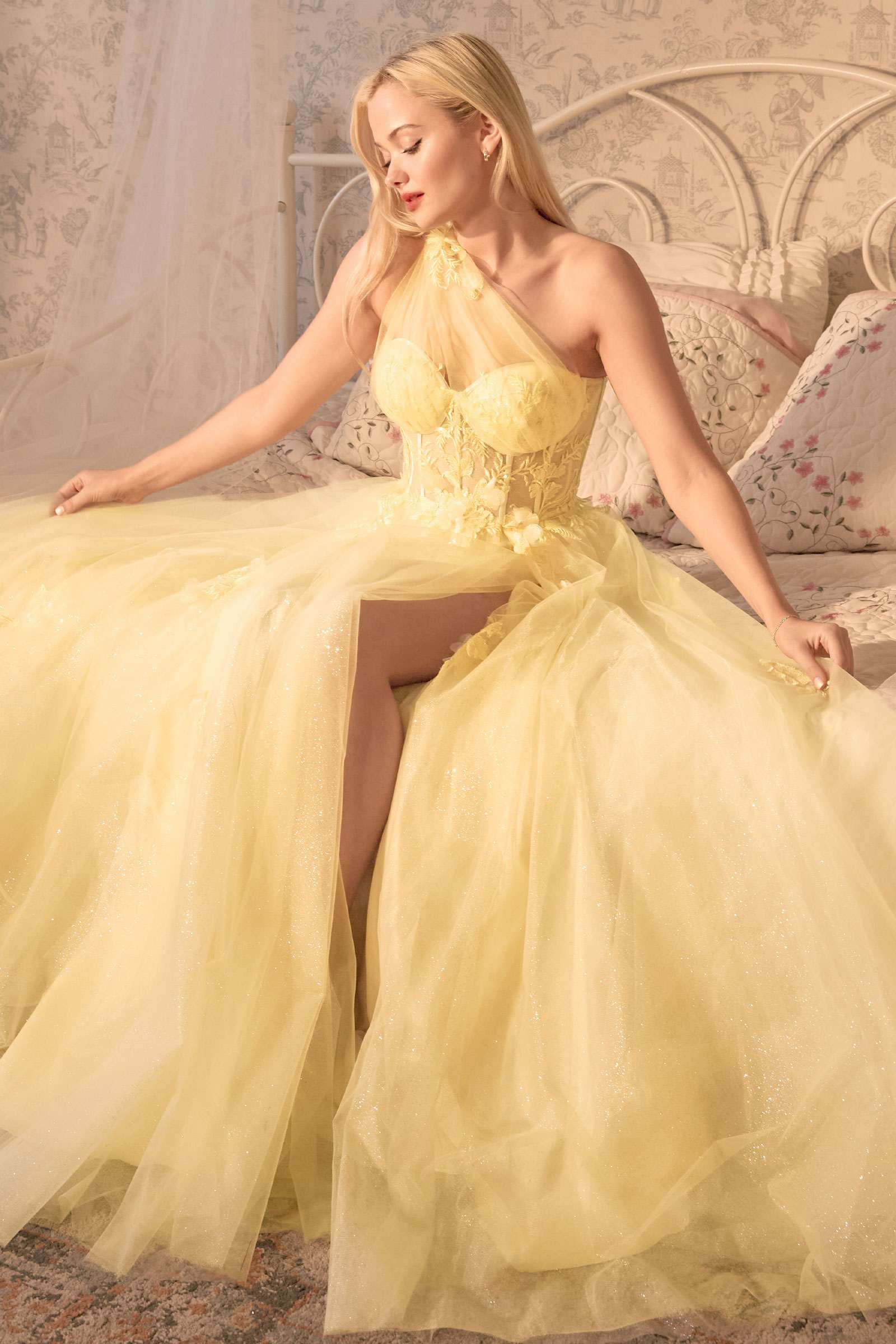 A-line ball gown with sweetheart bodice, lace embroidery, and dramatic layered tulle skirt