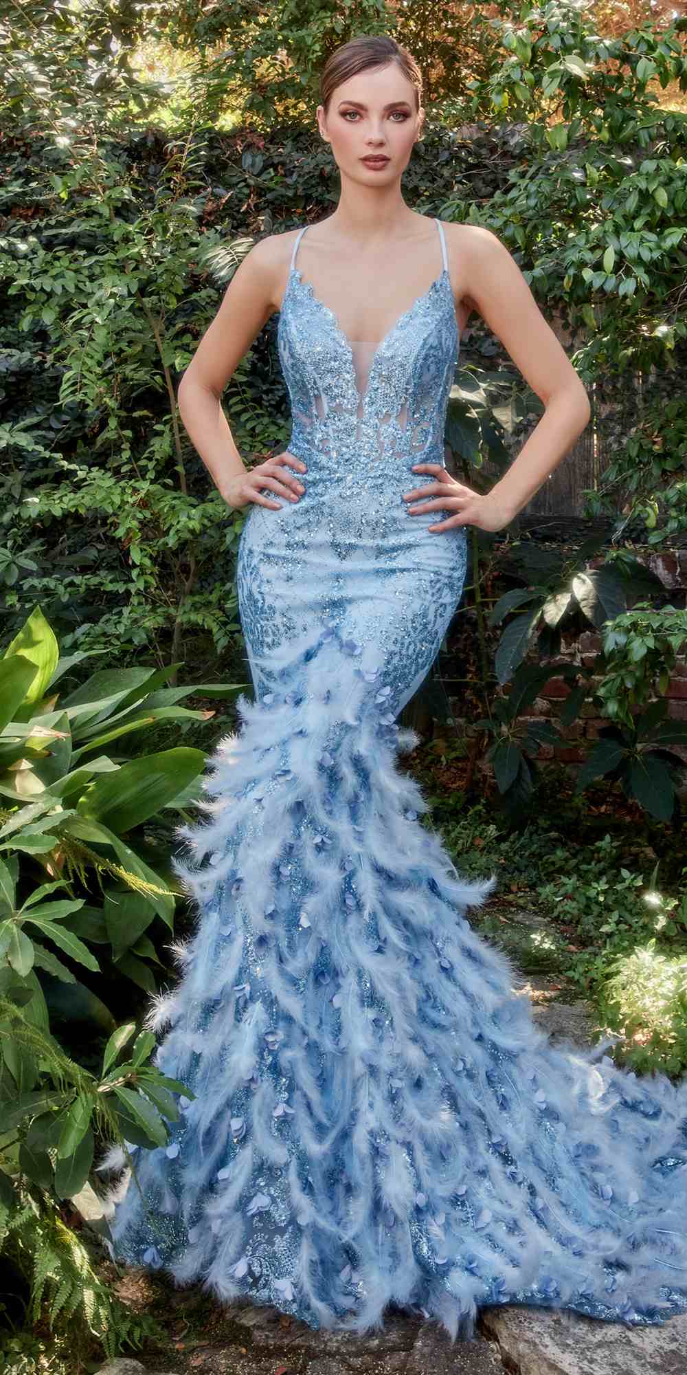 Light blue feathered mermaid gown with V-neck and spaghetti straps, ruffled feather hem.