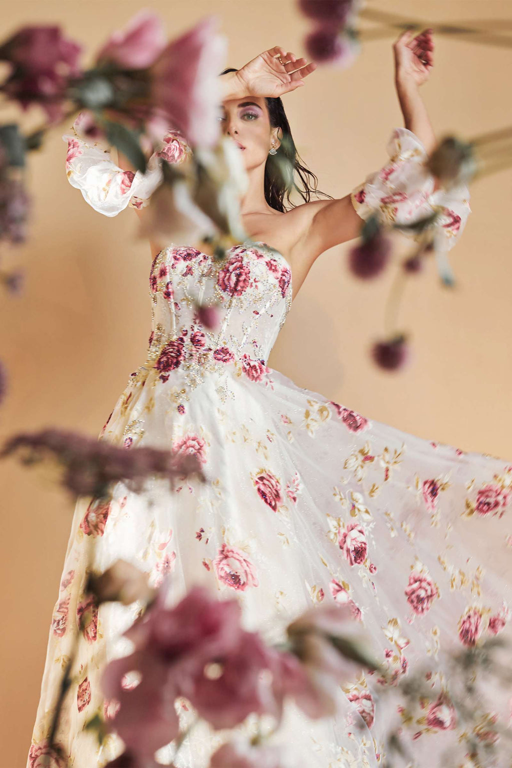 Strapless organza ball gown with peony floral print and sheer puff sleeves, twirling skirt
