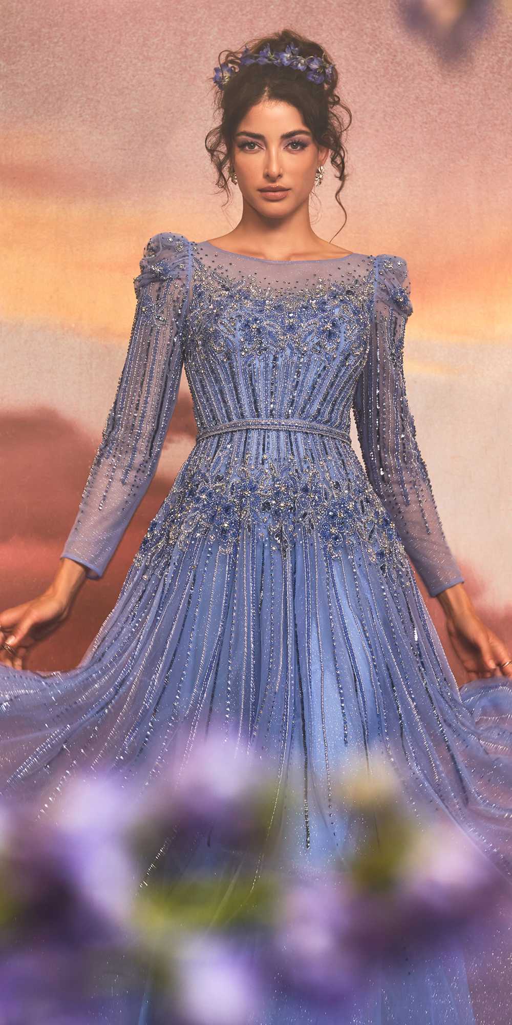 Blue beaded A-line gown with long sleeves, structured waist, off-shoulder neckline