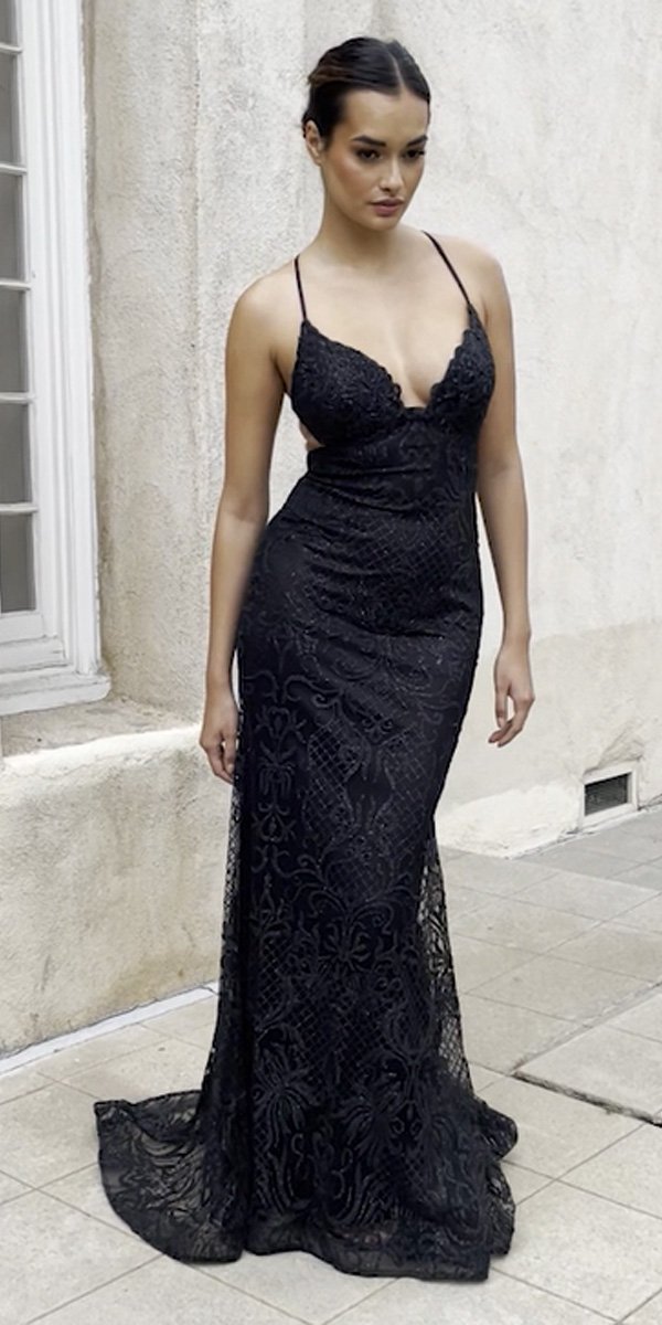 Black lace backless mermaid gown with spaghetti straps and V neckline, fitted.