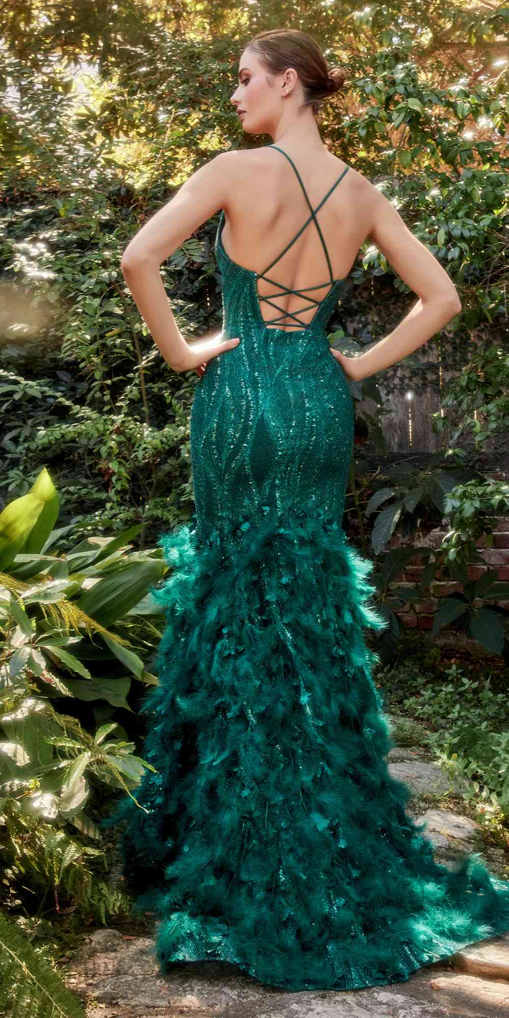 Emerald green mermaid gown, sequin bodice with crisscross back straps and feathered skirt