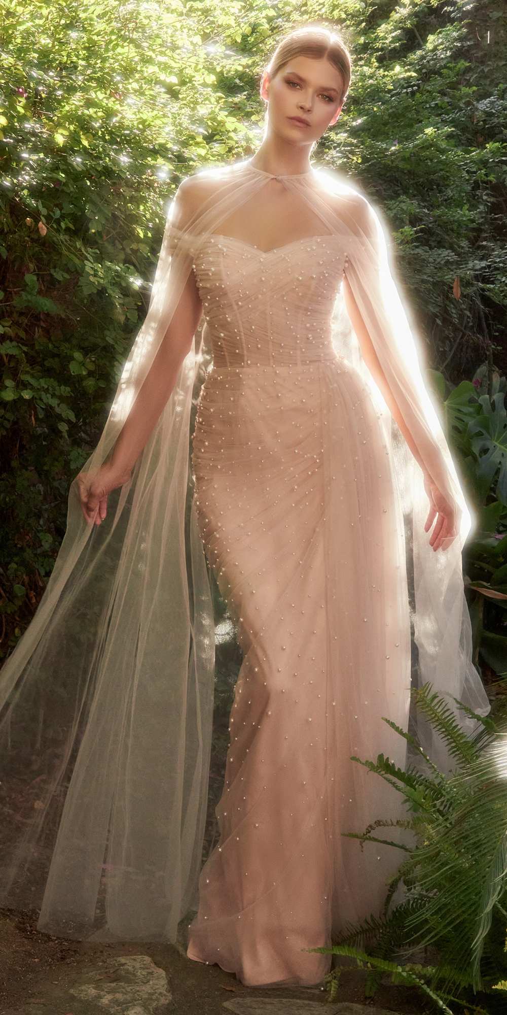 Blush pink pearl-embellished tulle floor-length gown with sheer cape sleeves