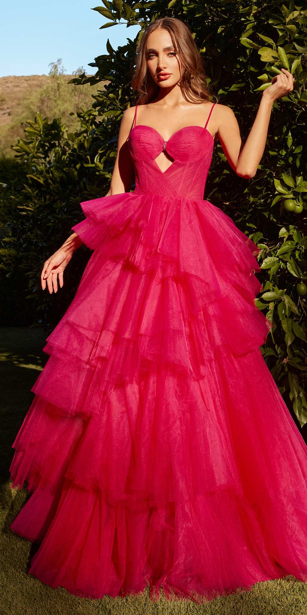 Azalea-pink tiered tulle ball gown with keyhole bodice and ruffled tier skirt