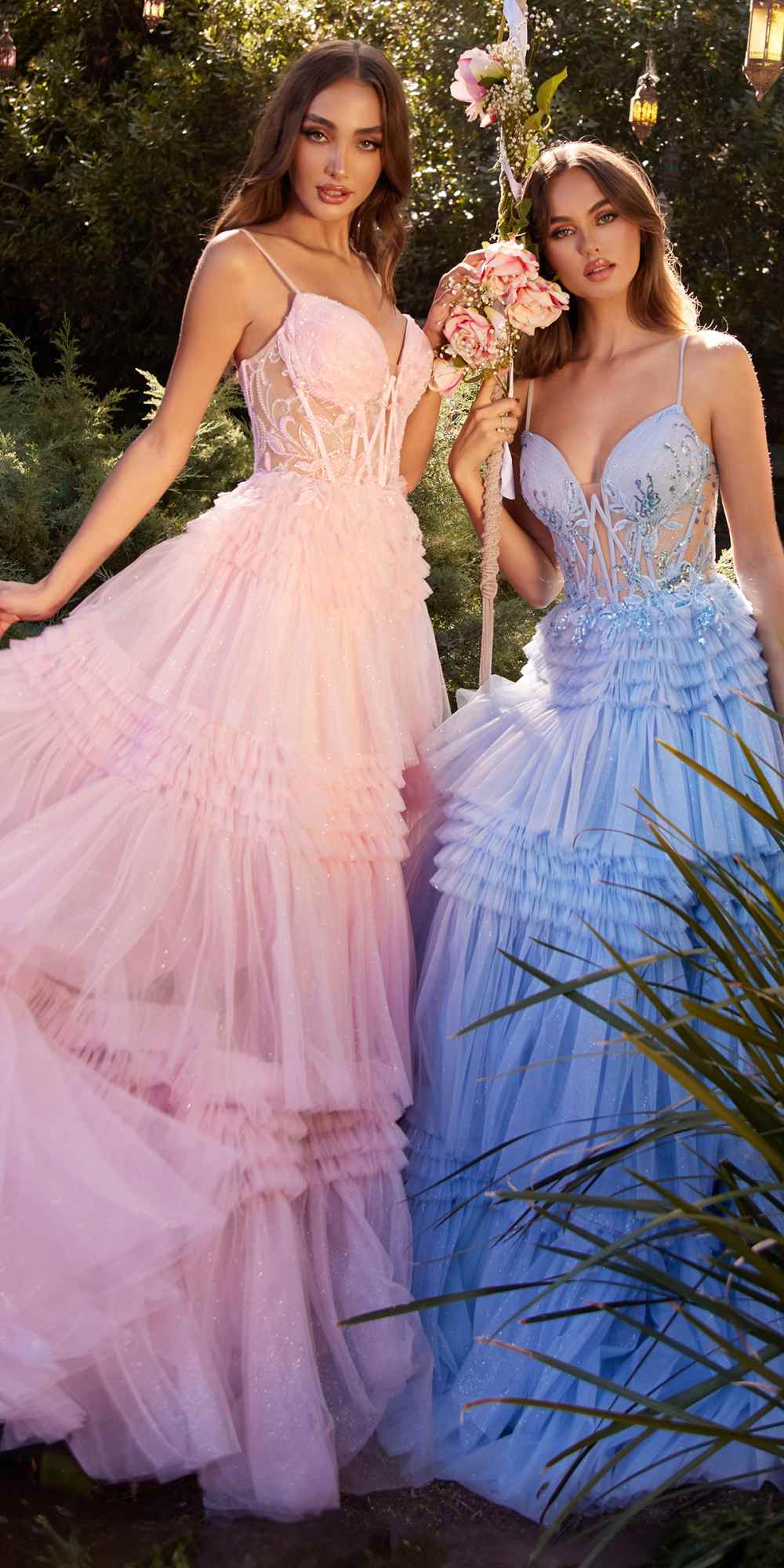 Layered tulle ball gowns in pale pink and light blue, both with corset bodices