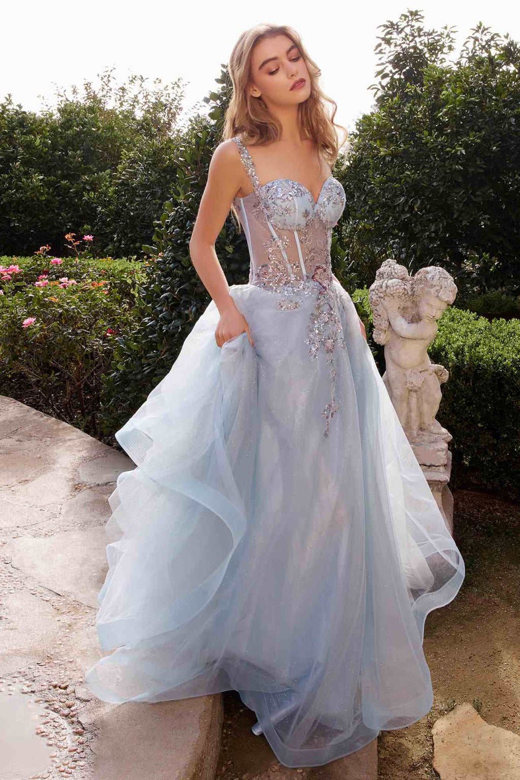 Dusty blue A-line tulle ball gown with sweetheart bodice and layered full-length skirt
