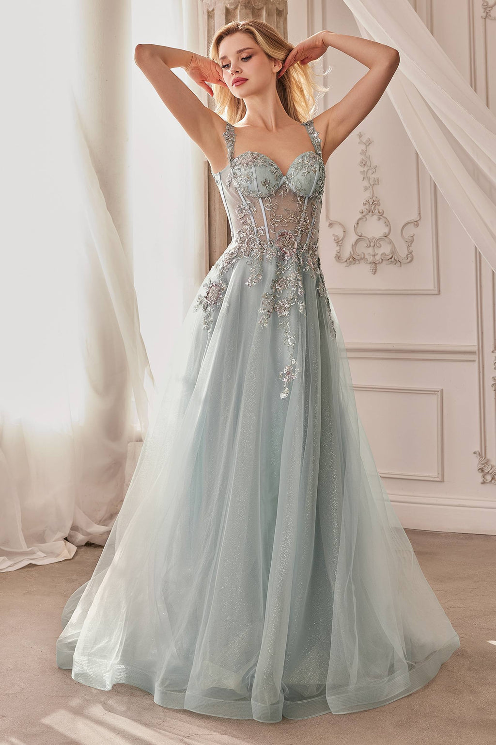 Dusty blue long A-line ball gown with embellished bodice and full tulle skirt, straps visible