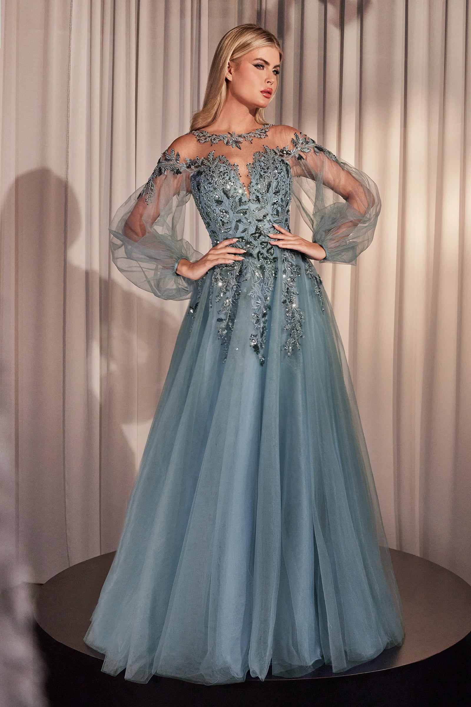 Teal A-line tulle lace gown with long sheer sleeves and beaded bodice