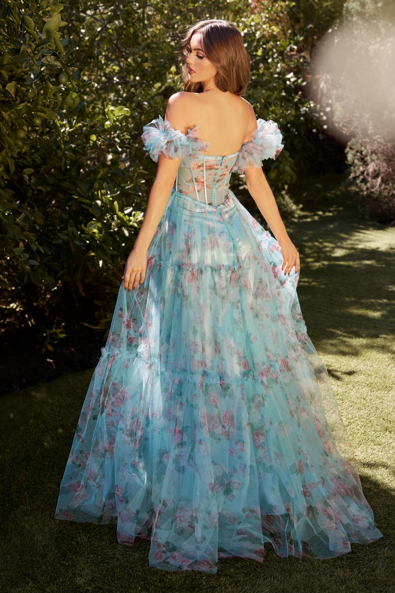 Blue off-the-shoulder sheer A-line gown with floral print, corset bodice, and ruffled puff sleeves