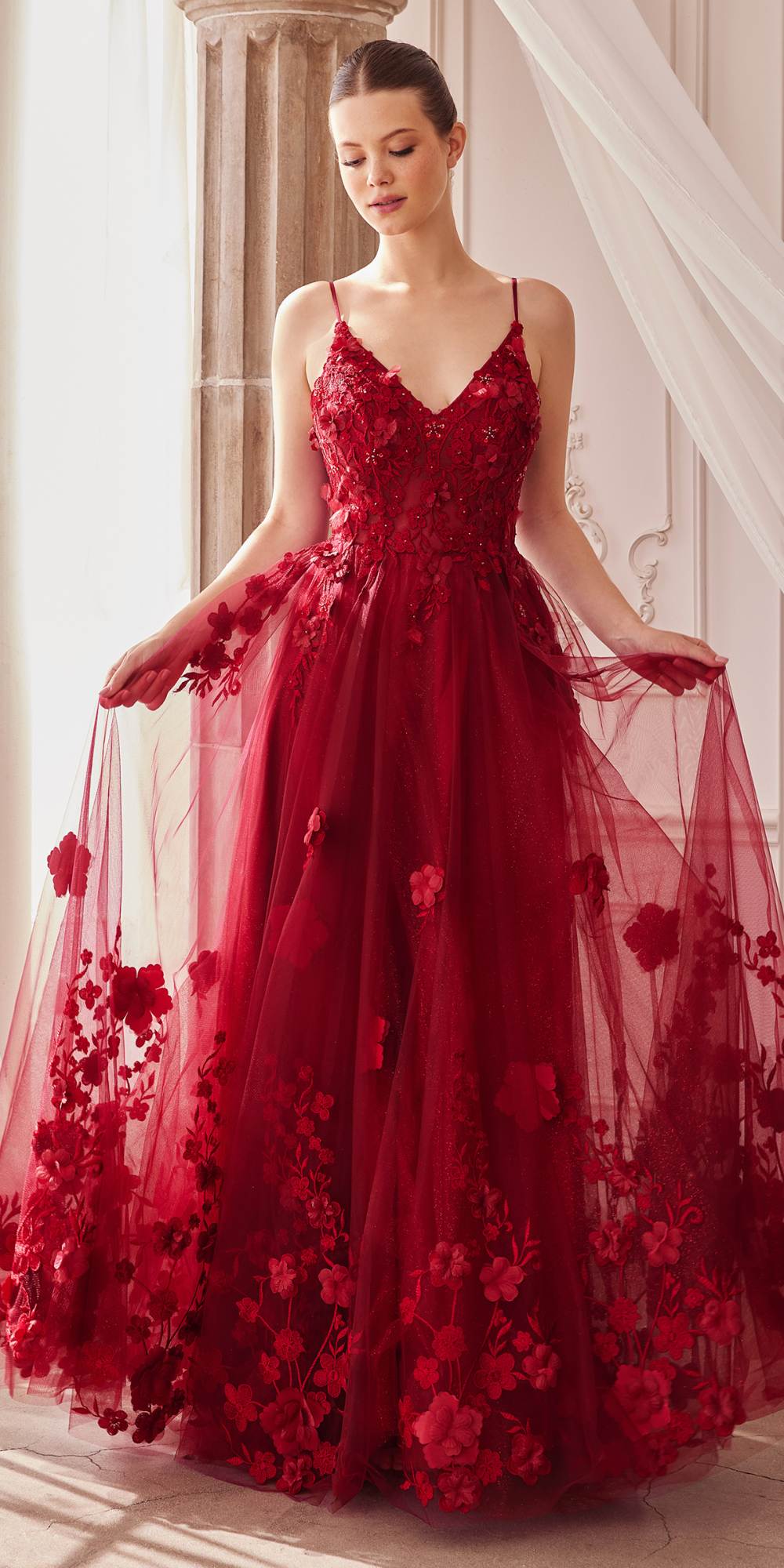 Crimson red A-line tulle gown with V-neck spaghetti straps and layered floral skirt detail