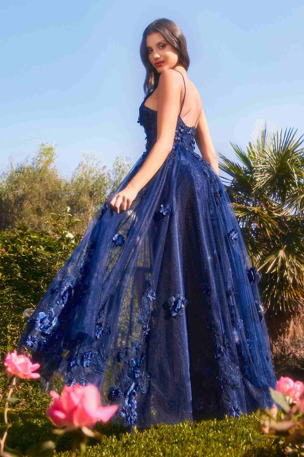 Navy blue A-line tulle gown with floral embroidery and V-neck spaghetti straps, full skirt