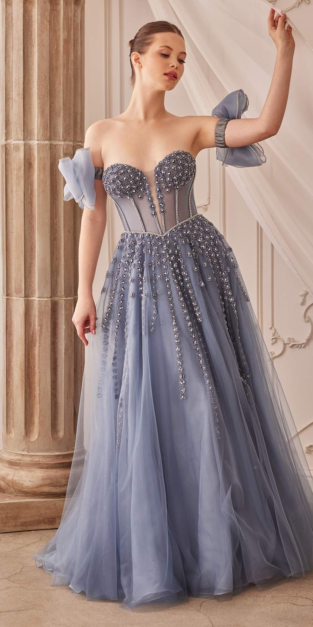 Midnight blue strapless beaded gown with bow arm bands and sparkly corset-style bodice.